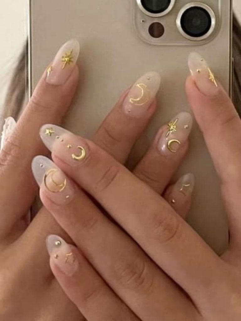 classy gold nails: celestial design