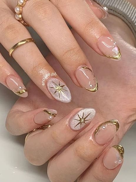 classy gold nails: celestial