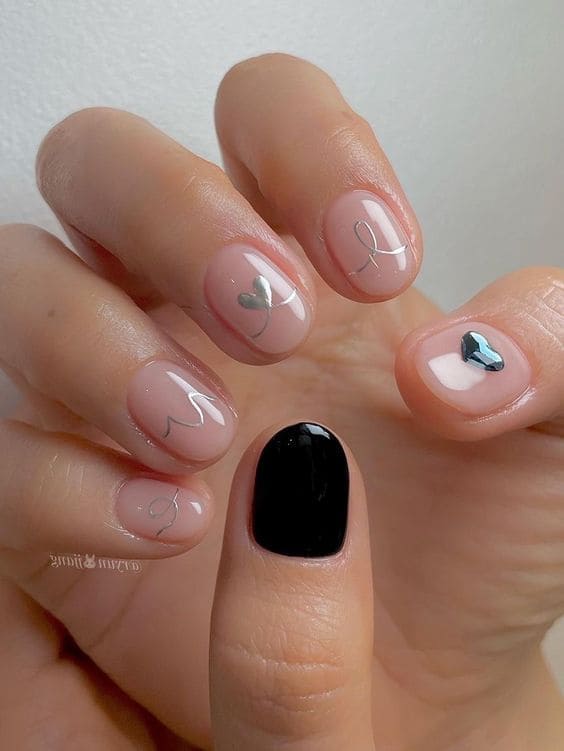 classic black nails with a heart 