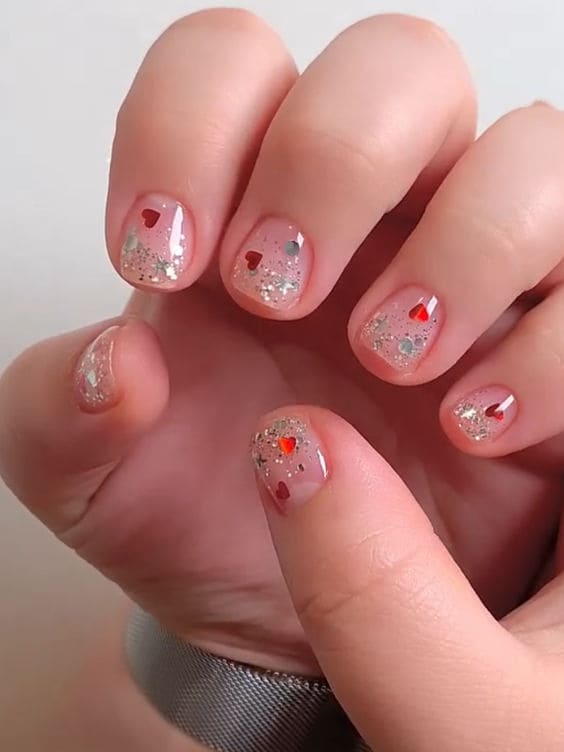 Korean Valentine's Day Nail Designs: heart confetti and glitter