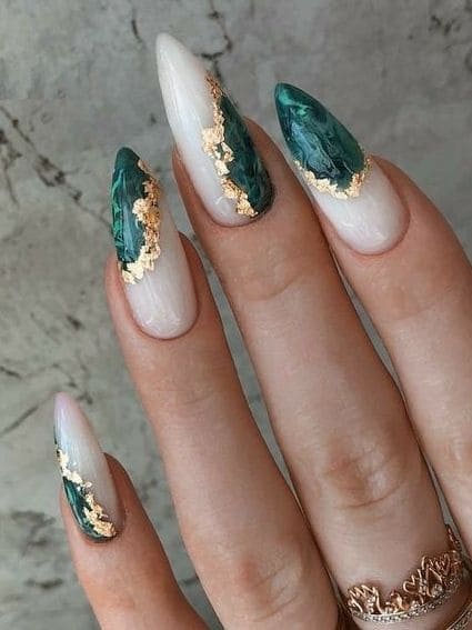emerald green nails: marble and gold foil negative space 