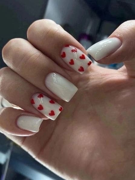 milky white nails with red hearts