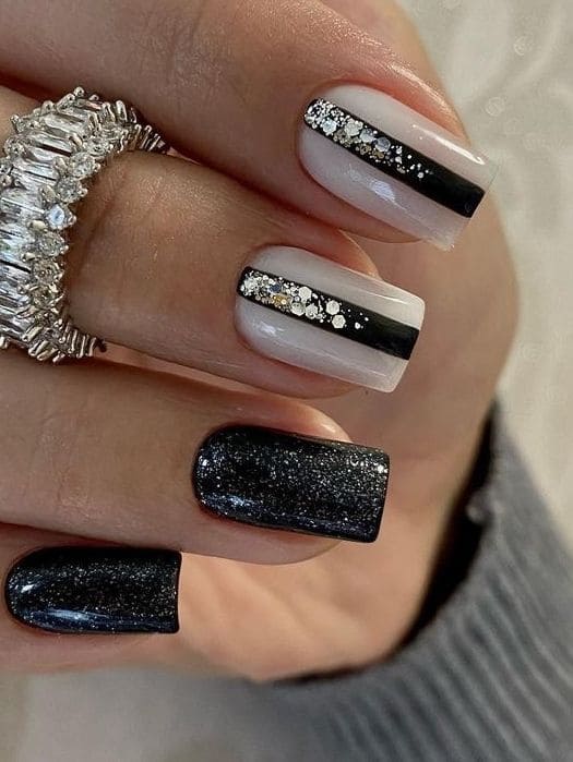 shimmery black nails with gems