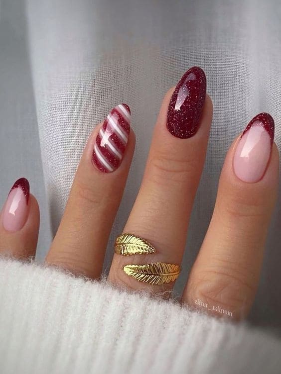 shimmery red nails with stripes 
