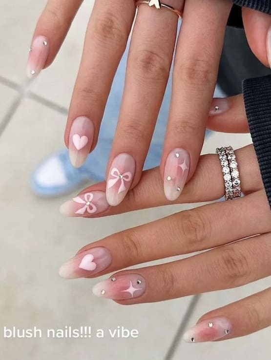 coquette nails: blush accent with cute accents 