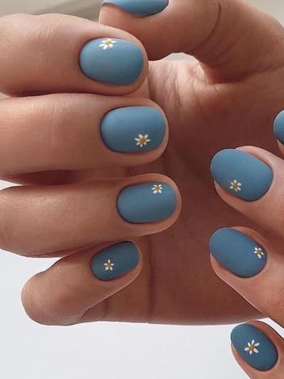daisy nail design: deep, muted blue 