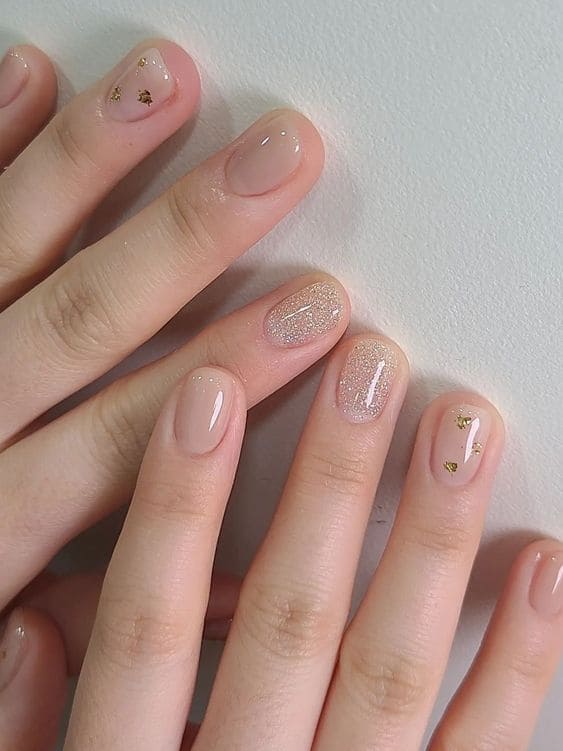 beige short nails with gold foil 