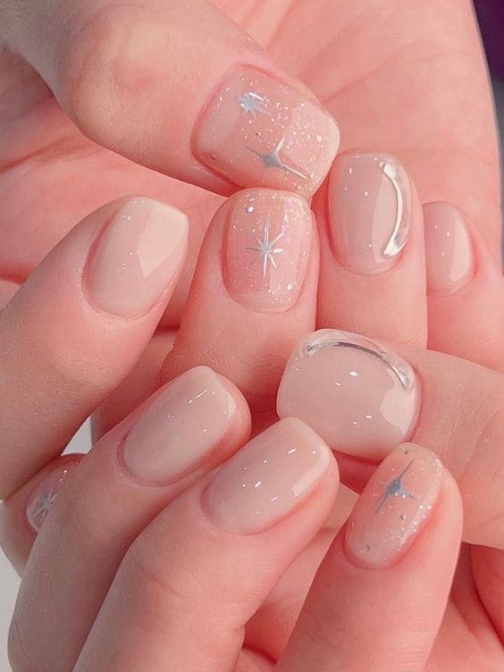 milky white nails with sparkle 