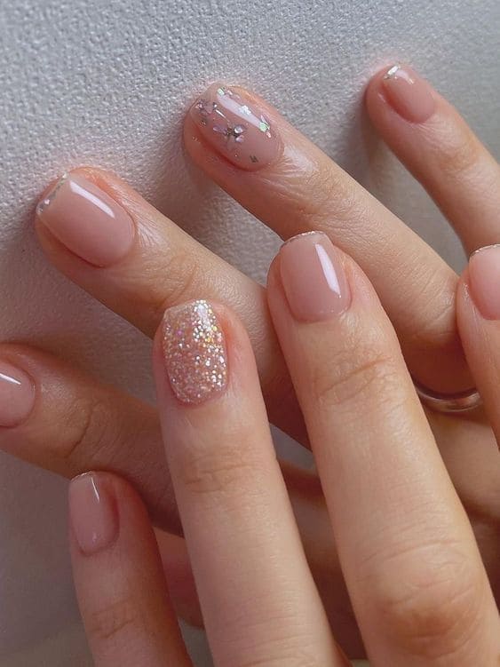 subtle, chunky glitter accent French tips