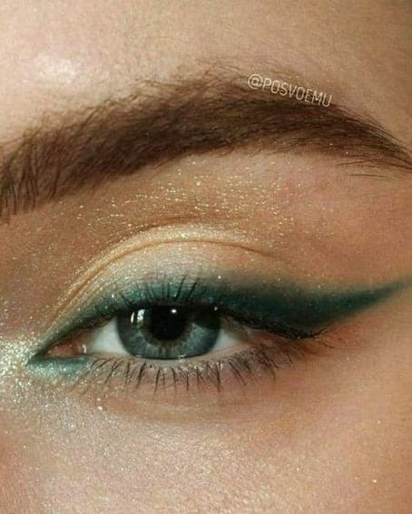 gold eyeshadow and green liner