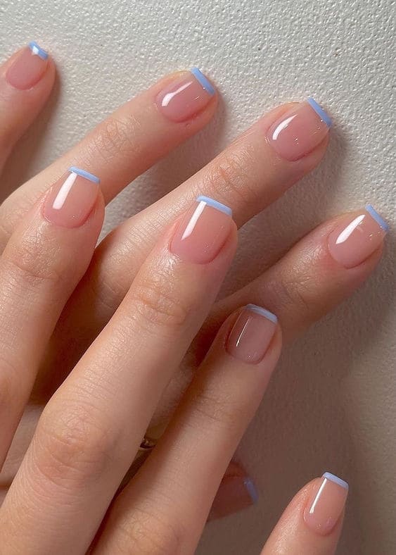 light blue nails: French tips
