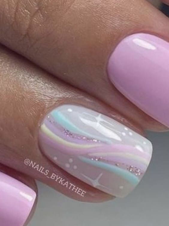 easter nail design: pink nails with pastel swirls 