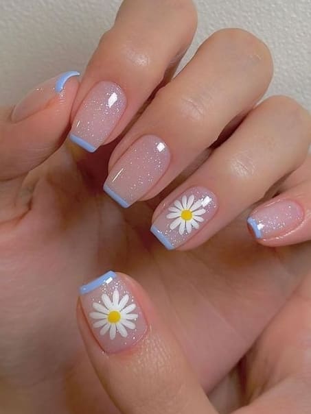 simple flower nail designs: glitter base and light blue French tips