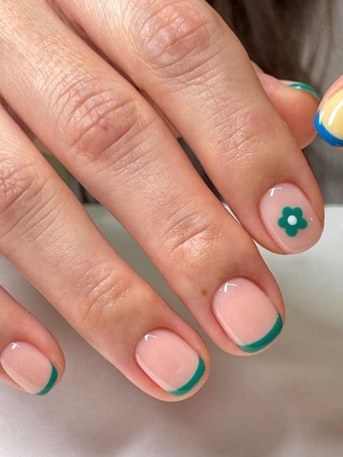 simple flower nail designs: green French tips