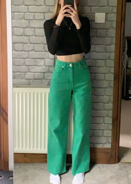 st. patrick's day outfit: black top and green jeans 