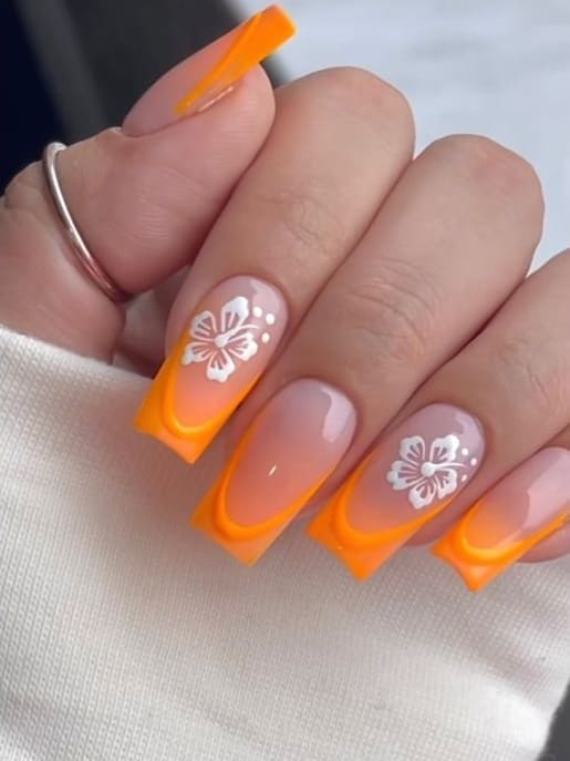 tropical nail design: orange ombre with simple flowers 