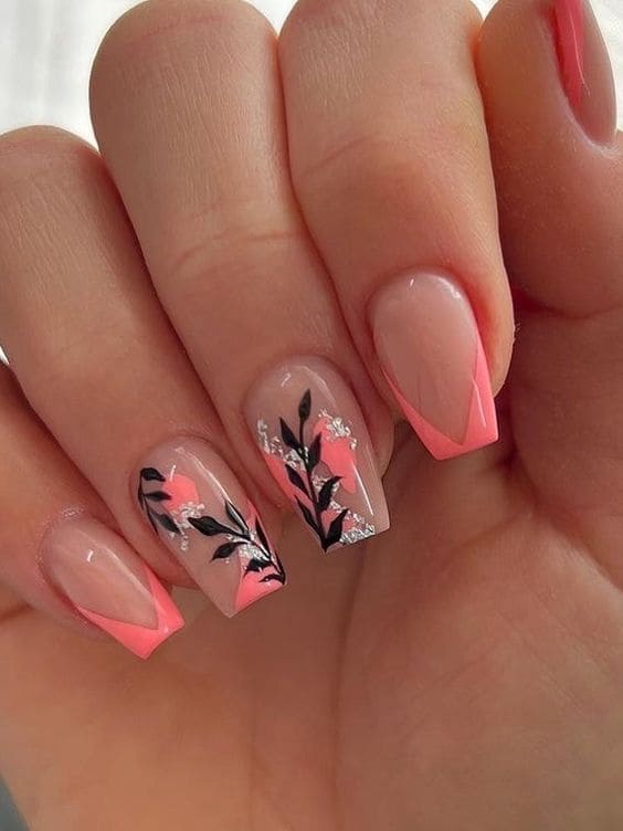 coral nail design: chevron tips with black leaves