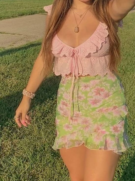 cute summer outfit: pink eyelet blouse top and mini skirt 