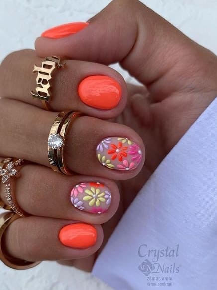 neon nail design: orange with flowers 