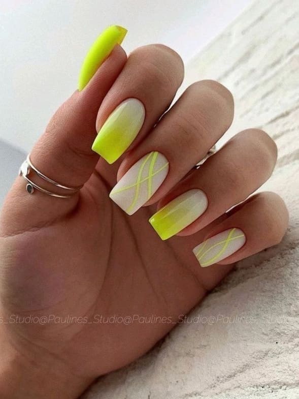 neon nail design: yellow ombre with swirls 
