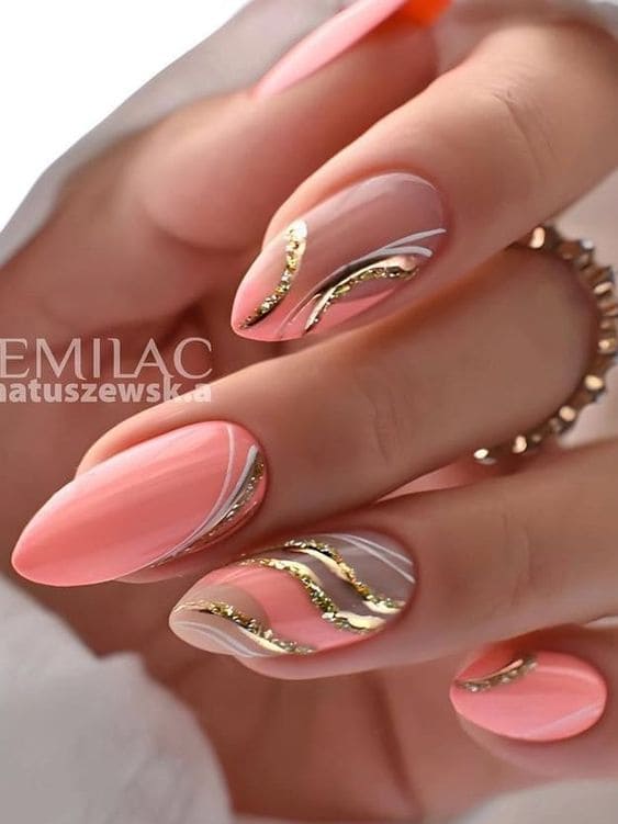 peach nail design: gold swirls