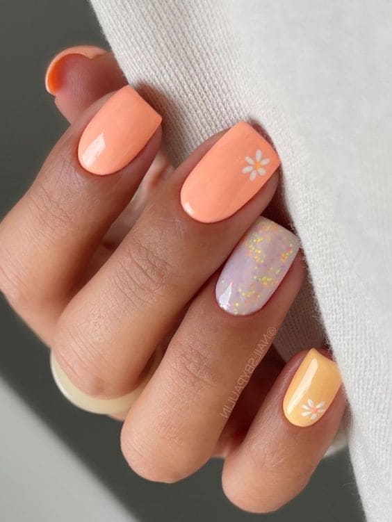 peach nail design: tiny floral accent 