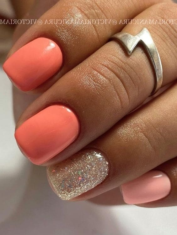 peach nail design: gold glitter accent 