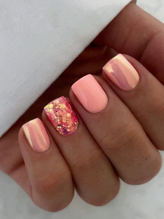 peach nail design: chrome and glitter  