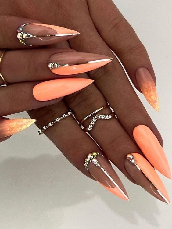 peach nail design: pastel orange stilettos