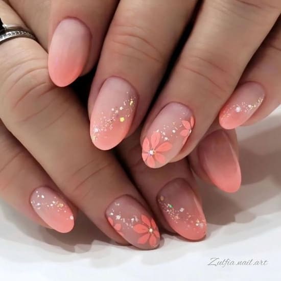 peach nail design: ombre nails with florals 
