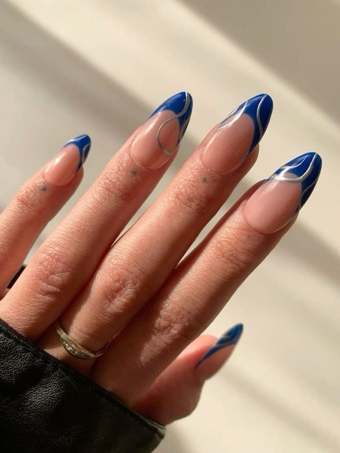 prom nails: blue French tips with swirls  