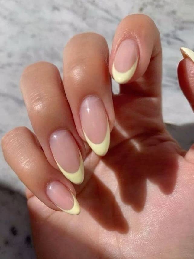prom nails: pastel yellow French tips