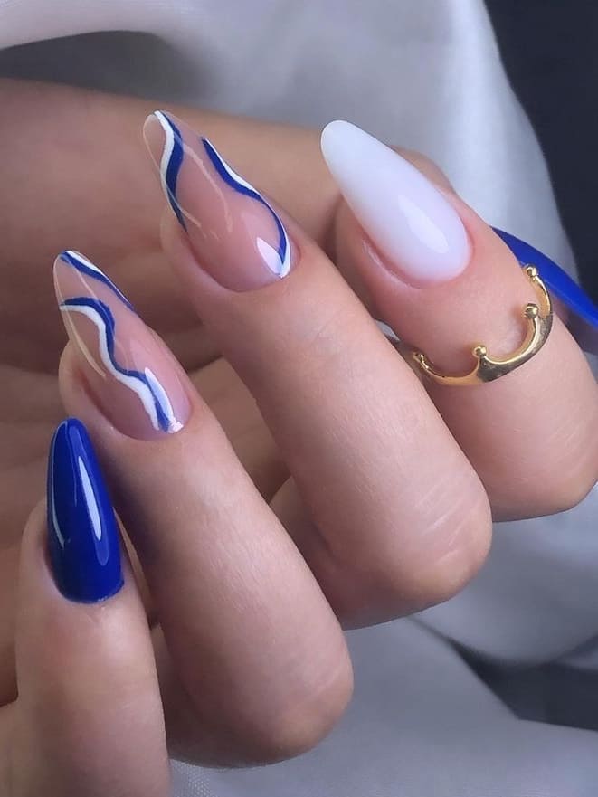 royal blue nails: white and blue swirls 
