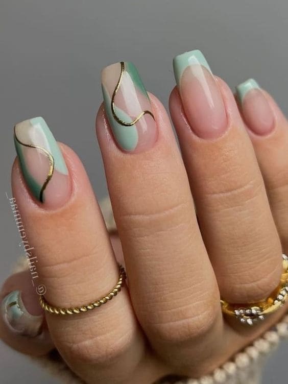 sage green nails: swirls 