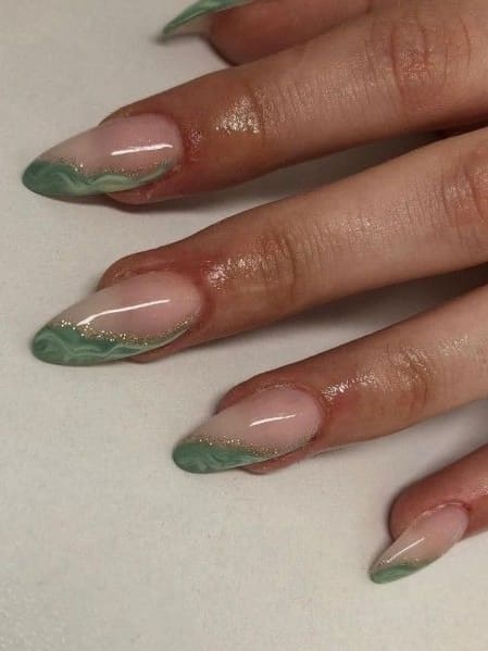sage green nails: marble side tips