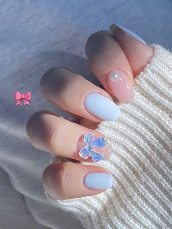 white nail design: 3d bow charms