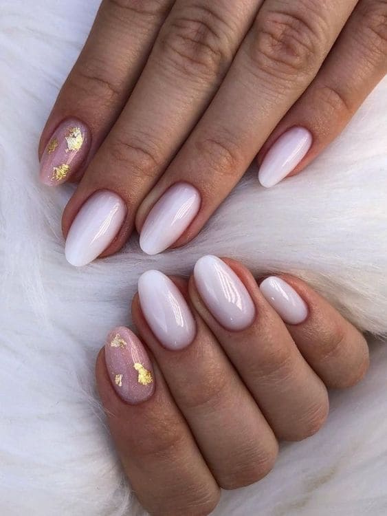 white nail design: gold foil accent