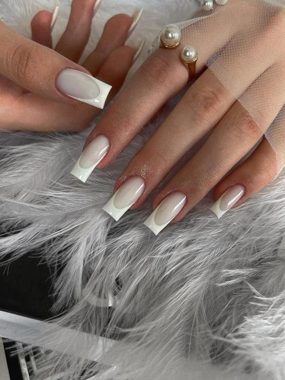 white nail design: long acrylic French tips